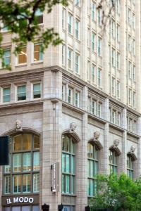 a large stone building with many windows at Kimpton - Harper Hotel by IHG in Fort Worth