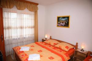 Posteľ alebo postele v izbe v ubytovaní Guest House Mijić + 37 fotografií