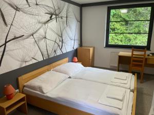 Voodi või voodid majutusasutuse Hotel Bohemia toas