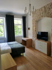 TV a/nebo společenská místnost v ubytování APARTAMENTY PRZY PARKU- Parking GRATIS!!!