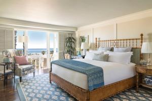 a bedroom with a bed and a view of the ocean at Shutters On The Beach in Los Angeles +28 photos