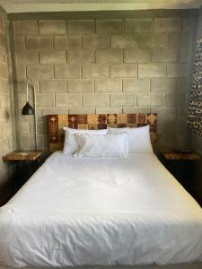 Tempat tidur dalam kamar di CÁLIDO COSMOS HOTEL