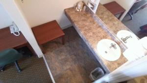 an overhead view of a bathroom with two sinks at Riverside Inn in Glendive
