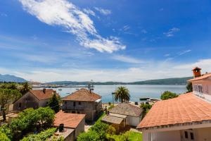 a view of the water from the roofs of houses at Rosić Apartments in Tivat