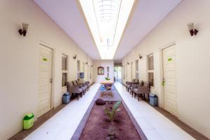 A seating area at Ardhya Guesthouse Syariah by ecommerceloka