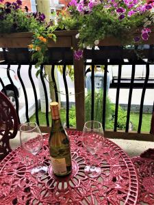 a bottle of wine sitting on a table with glasses at Ottawa Downtown Executive Apartment Retreat with Private Balcony near Bank Street - Sleep Max 2 in Ottawa