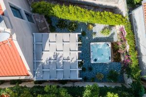 an overhead view of a garden with a swimming pool at Villa Stone Pearl in Sutivan