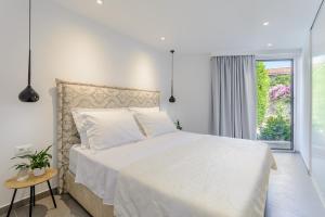 Posteľ alebo postele v izbe v ubytovaní Villa Stone Pearl