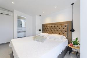 Posteľ alebo postele v izbe v ubytovaní Villa Stone Pearl
