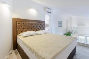 Posteľ alebo postele v izbe v ubytovaní Villa Stone Pearl