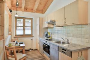 a kitchen with a sink and a counter top at Fewo Ammertal in Oberammergau