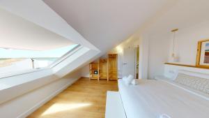 Кровать или кровати в номере Apartamentos La Casa El Palo