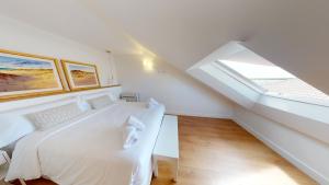 Кровать или кровати в номере Apartamentos La Casa El Palo