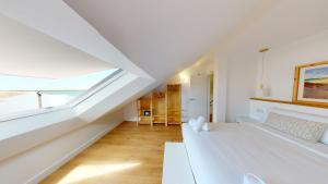 Кровать или кровати в номере Apartamentos La Casa El Palo