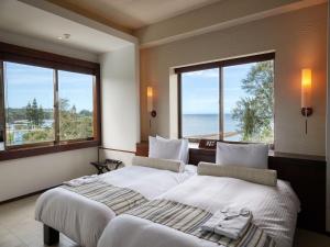 מיטה או מיטות בחדר ב-La Casa Panacea Okinawa Resort