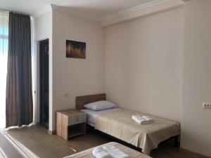 Postel nebo postele na pokoji v ubytování Chaki Hotel