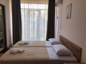 Postel nebo postele na pokoji v ubytování Chaki Hotel