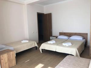 Postel nebo postele na pokoji v ubytování Chaki Hotel