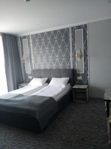 Voodi või voodid majutusasutuse Mon Ami Hotel toas