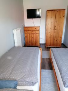 Postel nebo postele na pokoji v ubytování Családbarát apartman