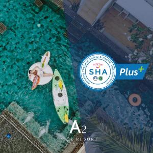 a woman sitting on a paddle board in the water at A2 Pool Resort - SHA Plus in Phuket Town