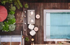 an overhead view of a building with plants and a window at Small Luxury Hotel of the World - DasPosthotel in Zell am Ziller