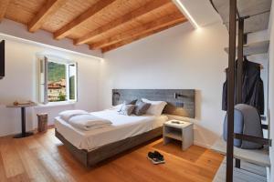מיטה או מיטות בחדר ב-Le Terre di Gu
