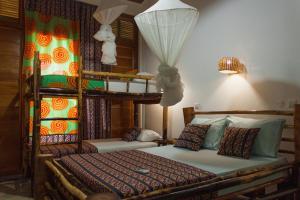 Ein Bett oder Betten in einem Zimmer der Unterkunft Residêncial Tamarindos