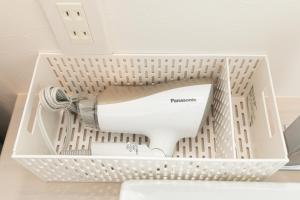 a white box with a hair dryer in it at Villa Roppongi in Tokyo