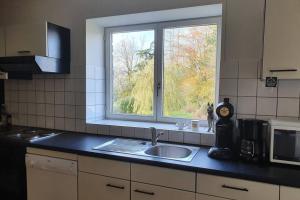 Kuchyň nebo kuchyňský kout v ubytování Charmante duplex