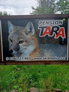 a sign with a wolf on the side of it at pension TARA in Teplice nad Metují