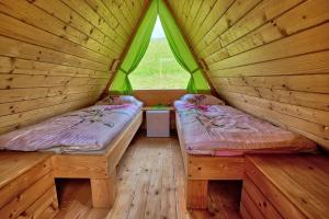Postel nebo postele na pokoji v ubytování Glamping Brodej