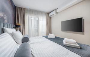 Postel nebo postele na pokoji v ubytování Val di Sole 2