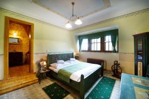 a bedroom with a large bed in a room at Letohrádek sv. Vojtěch in Počátky