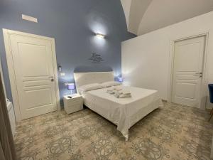 Posteľ alebo postele v izbe v ubytovaní Donna Grazia Relais
