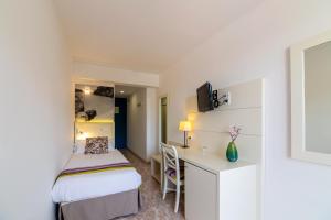 Postel nebo postele na pokoji v ubytování Hotel Venecia Paguera