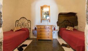 Postel nebo postele na pokoji v ubytování Casa Cueva El Caidero