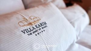 Postel nebo postele na pokoji v ubytování Villa Karim