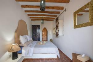 Postel nebo postele na pokoji v ubytování Absolu Beldi Essaouira + 19 fotografií