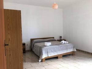 Cama ou camas em um quarto em Appartamenti Vista Mare