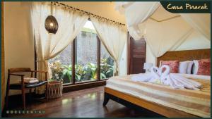 A bed or beds in a room at CASA PINARAK 1 I 3BR Private Villa near Seminyak