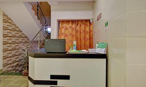 a room with a counter with a laptop on it at Treebo Trend Paradise Inn Panchgani in Mahabaleshwar