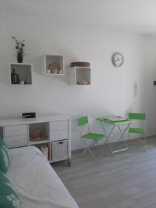 a bedroom with a bed and a table and chairs at Casa del Leccio in Pulsano