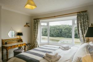 Una cama o camas en una habitación de Finest Retreats - Tideway