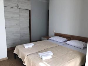 Postel nebo postele na pokoji v ubytování Chaki Hotel
