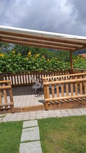 a wooden bench sitting on top of a patio at Astra in Agerola