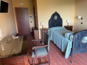 A bed or beds in a room at Il Castello dei Principi Sanseverino