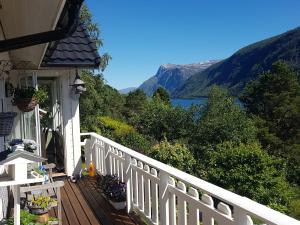 a porch of a house with a view of a lake at Between Fjord og Glacier in Ålfoten