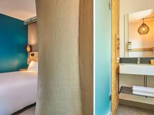 Un ou plusieurs lits dans un hébergement de l'établissement Greet Hotel Paris porte de la Chapelle - Aréna