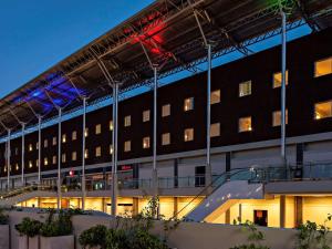 a large building with a staircase in front of it at ibis Pilar in Pilar